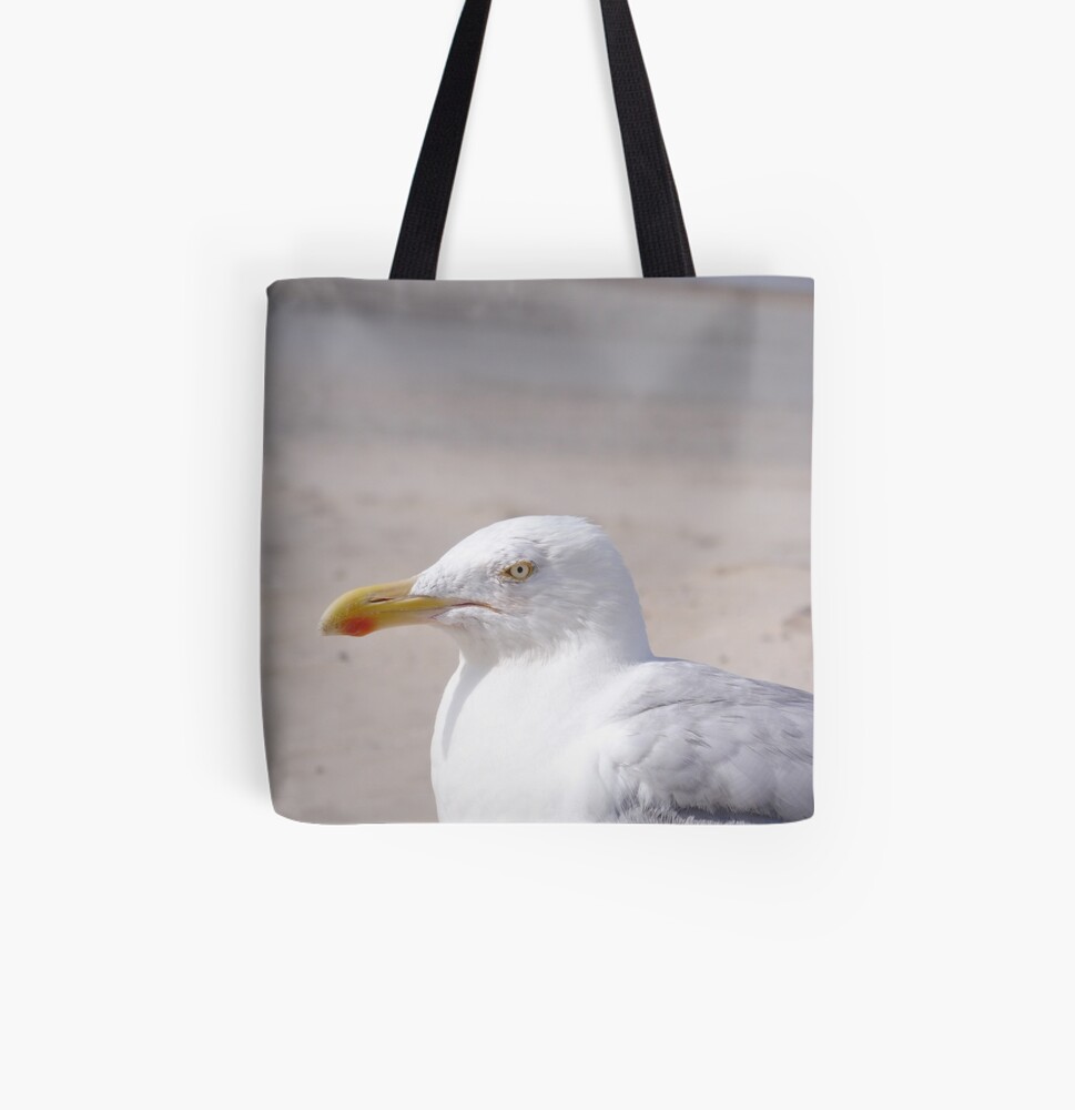 Product image for tote bag: Seagull looking sideways on a beach.